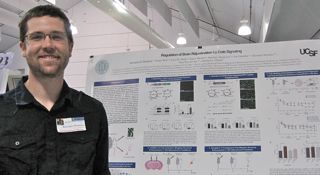 PSM cohort 3 student Kris Plamback in front of his poster in May 2014